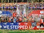 General view of a giant replica trophy as Luton Town's Sonny Bradley lifts the trophy with the team after winning the Championship Playoff Final on May 27, 2023