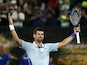 Serbia's Novak Djokovic celebrates after winning his fourth round match against France's Adrian Mannarino on January 21, 2024